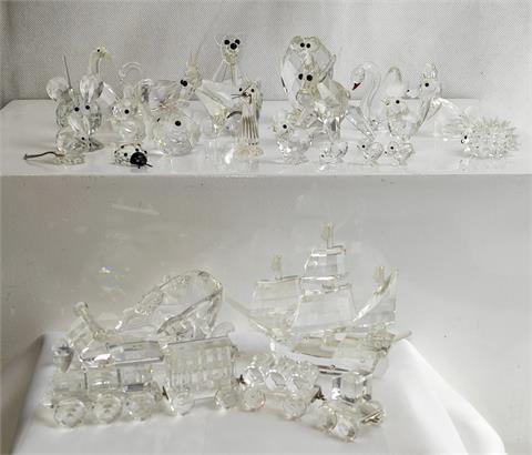 Konvolut aus 22 Kristallfiguren, überwiegend Swarovski